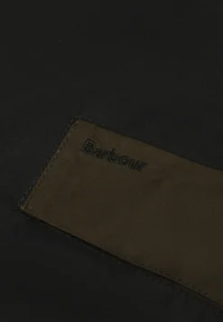 BARBOUR | CHAQUETA ENCERADA PATCHWORK TRANSPORT