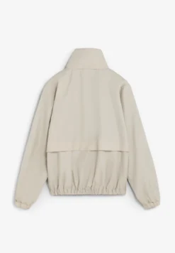 CHAQUETA TÉCNICA CON CAPUCHA OCULTA