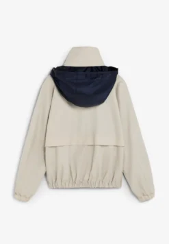 CHAQUETA TÉCNICA CON CAPUCHA OCULTA