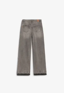 JEANS TACHUELAS BAJO DESFLECADO