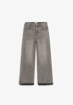 JEANS TACHUELAS BAJO DESFLECADO