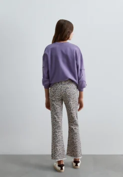 PANTALÓN FLARE ESTAMPADO ANIMAL